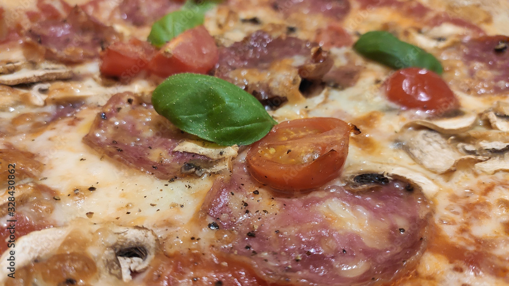 Close up of delicious Sicilian pepperoni pizza with mushrooms and mozzarella Close up of delicious Sicilian pepperoni pizza with mushrooms and mozzarella
