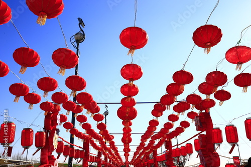 Is the red lantern hanging in the air