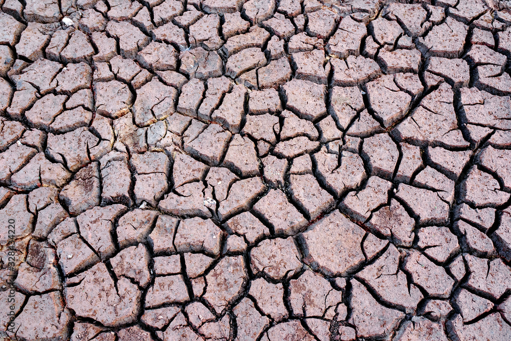 Ground soil surface Mosaic pattern of dry, sunny soil in the northeast region of Thailand Ground soil surface Mosaic pattern of dry, sunny soil in the northeast region of Thailand