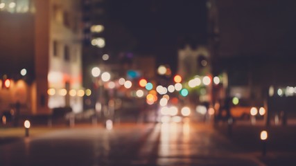Abstract blur urban city street road with people walking and lighting bokeh for background.