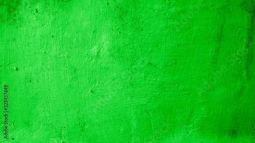 Rough concrete wall texture, bright green, vintage rustic grunge background