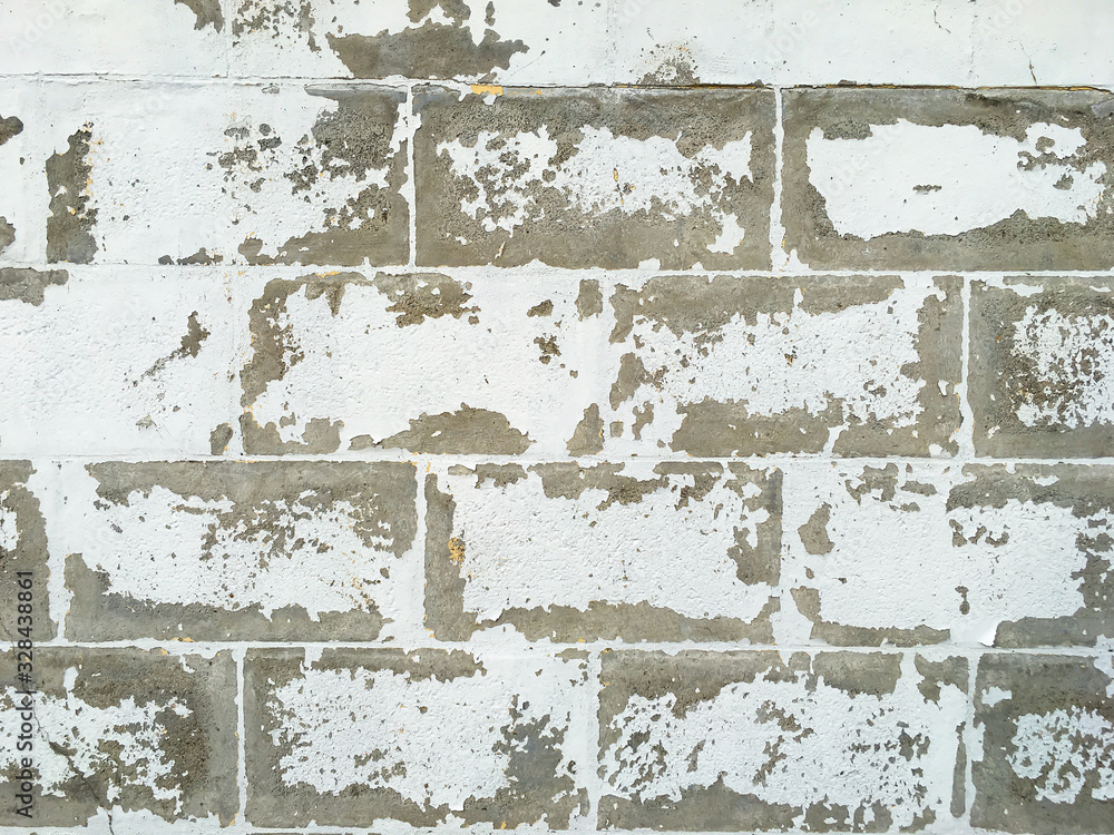 Obraz premium Peeled rough bricks concrete wall, Cement texture, White painted colour background, Interior and Exterior home concept