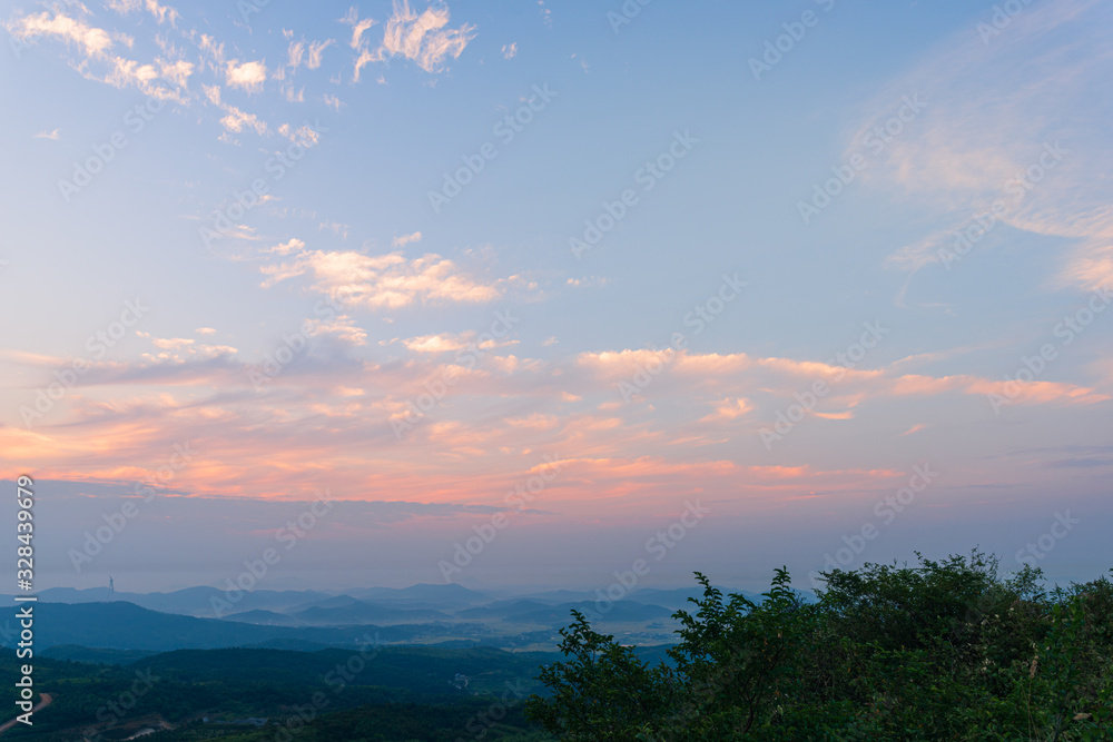 Composition of beautiful sky background, forest and sunset.