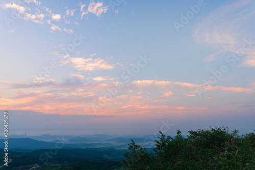 Composition of beautiful sky background, forest and sunset.