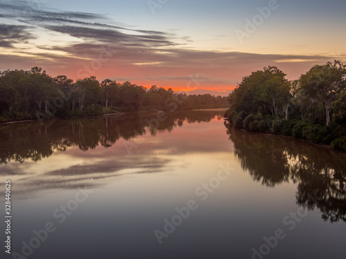 Fototapeta Naklejka Na Ścianę i Meble -  Colourful River Sunrise with Reflections