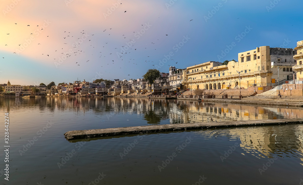 Pushkar Lake near Ajmer Rajasthan at sunset with ancient buildings