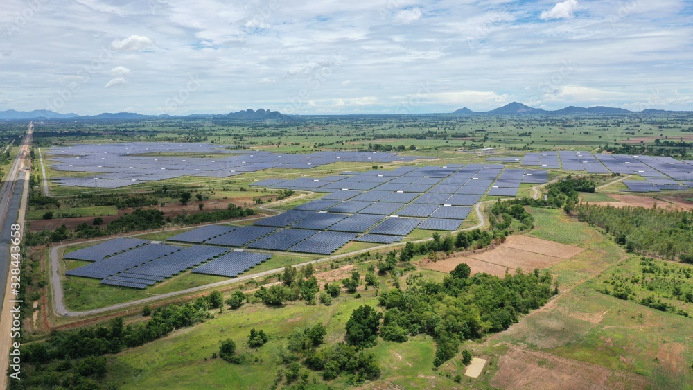 Naklejka premium Solar energy farm. Aerial view of a solar farm in Asia.