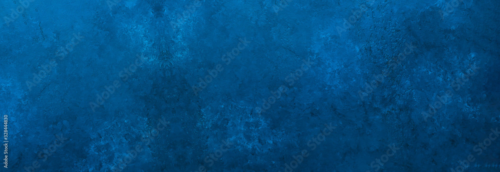 Dark slate background toned classic blue color. Long banner. Old textured background