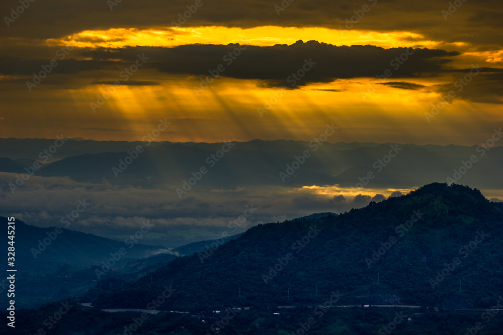 Fototapeta premium Natural background,high angle that overlooks blurred scenery from fog, rain that flows through,sees Buddha images,temples,mountains,is a viewpoint while traveling in Phetchabun,Khao Kho,Thailand