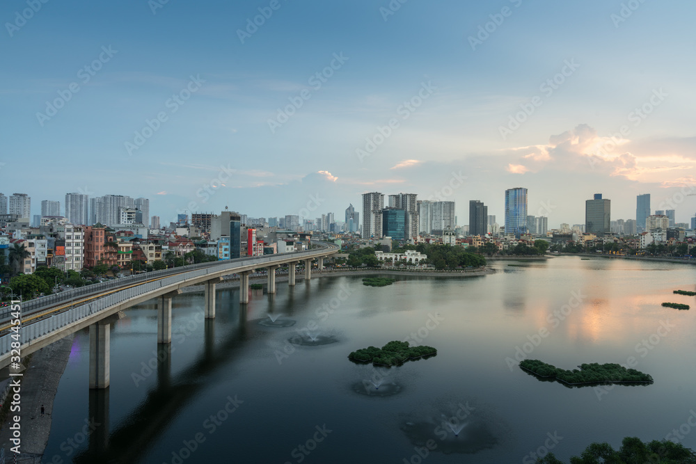 Fototapeta premium Aerial skyline view of Hanoi at Hoang Cau lake. Hanoi cityscape by sunset period