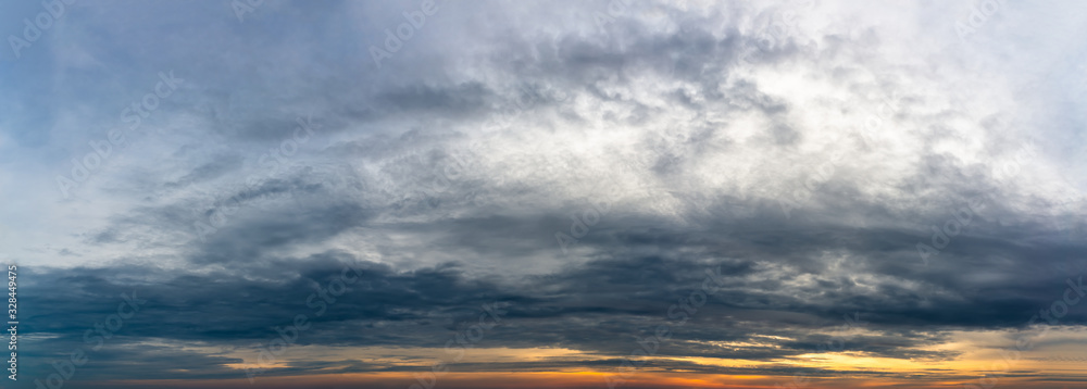 Fantastic dark thunderclouds at sunrise