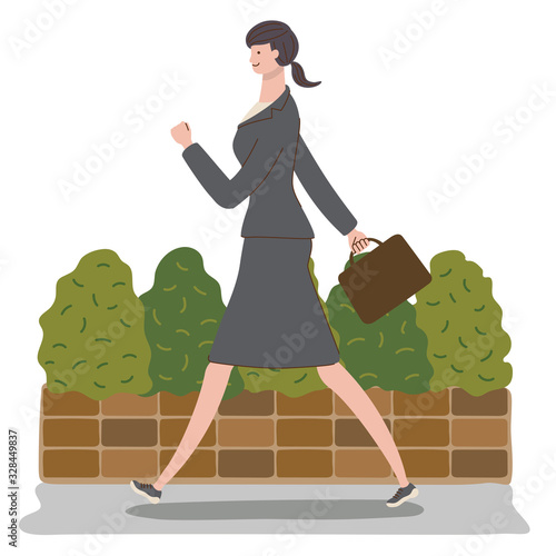 スニーカーで通勤するビジネスウーマン