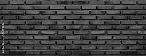 Fototapeta Vintage dark black panorama big file of brick wall for minimalism and hipster style background and design purpose