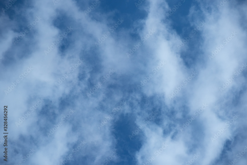 Obraz premium White cloud formation isolated against a bright blue sky image for background use with copy space