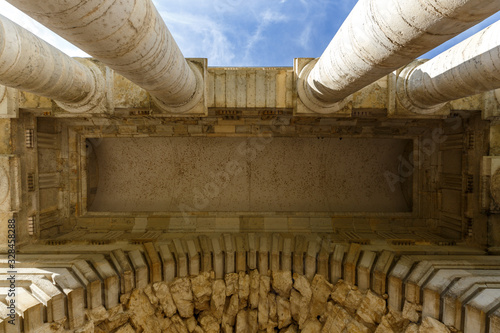 Stone pillars and roof ceiling of an ancient building