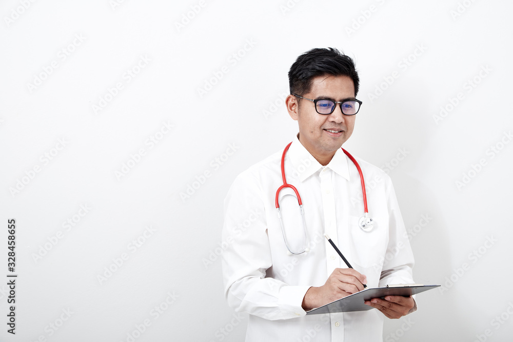 Male doctor writes on the document clipboard