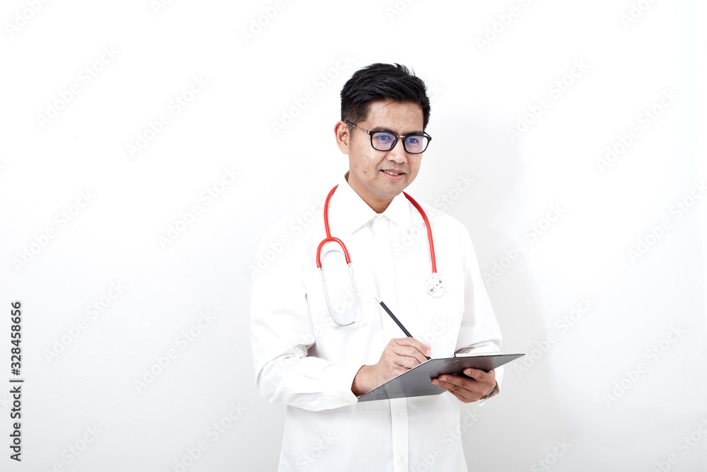 Male doctor writes on the document clipboard Male doctor writes on the document clipboard