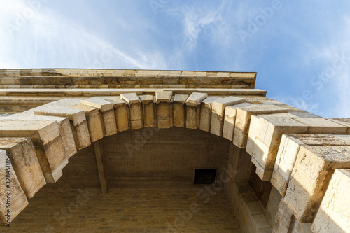 Stone pillars and roof ceiling of an ancient building © Sen