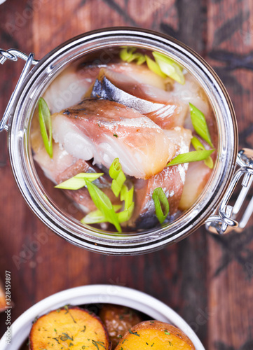 Marinated mackerel in a glass jar - snack under vodka