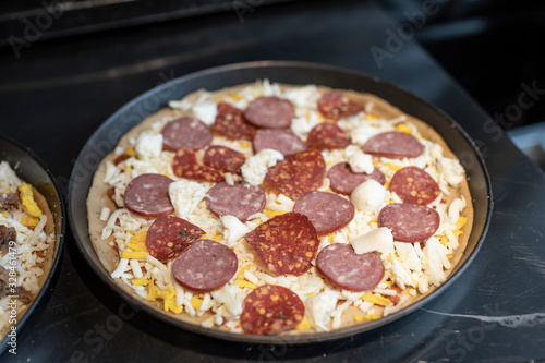 the salami pizza before cooking