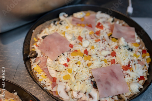 Turkey bacon pizza before cooking