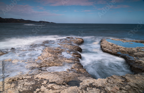 Waves breaking on the rocks near the shore