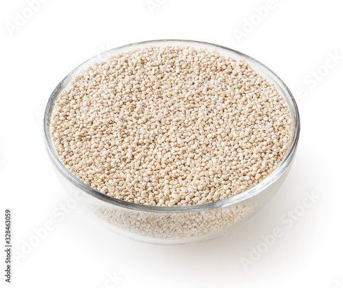 Dried white quinoa seeds in glass bowl isolated on white background with clipping path