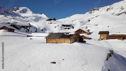 Isolated Cabin in Remote Village on Snowy Bachläger Mountain Landscape photo