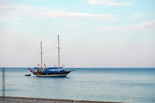 Old sailing boat is standing anchored  near the coast. © Adil