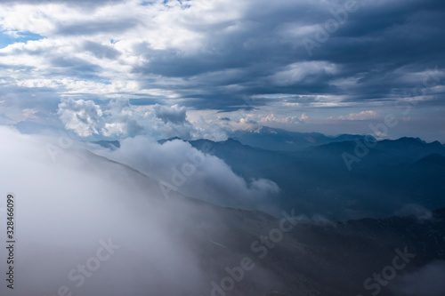 Beautiful view to Western Taurus mountain range with cloudy sky  captured from Tahtali mountain s peak.