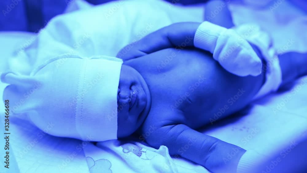 Newborn having a treatment for jaundice under ultraviolet light, Baby