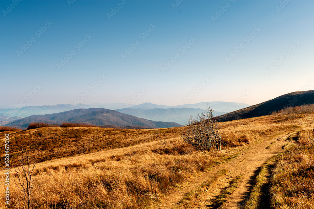 road in the mountains. Autumn landscape in sundown.