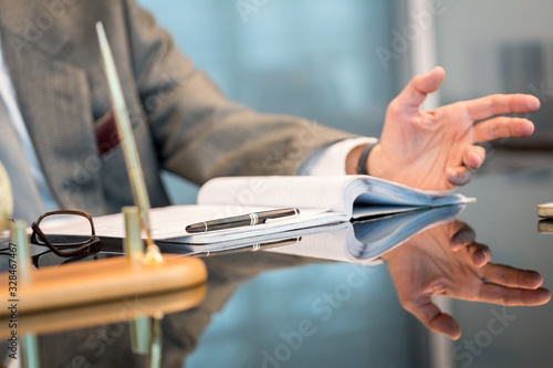 Business man hands in a gesture during negotiation or interview.