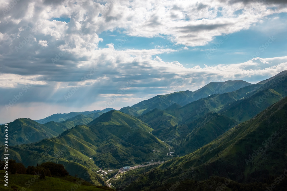 Almaty mountains with cloudy stormy clouds. Overcast - weather storm. Rain in mountains. Almaty mountains with cloudy stormy clouds. Overcast - weather storm. Rain in mountains.