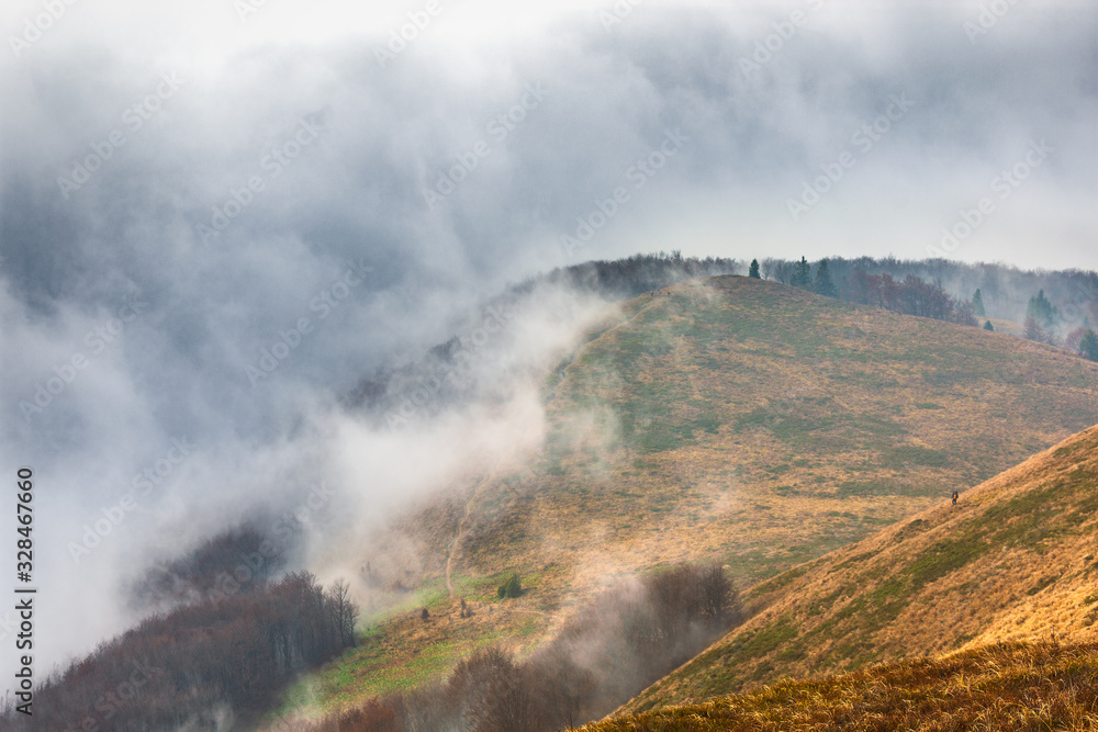rain, fog and clouds in the mountains. Autumn landscape.