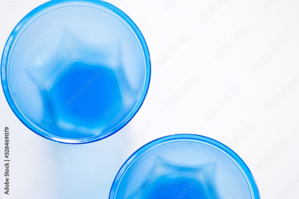 Disposable blue cups flat lay. Round abstract shapes. Selective focus Disposable blue cups flat lay. Round abstract shapes. Selective focus
