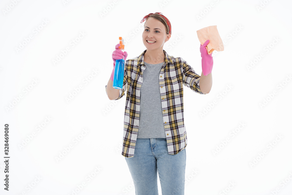 Portrait of happy female doing house duties wearing rubber gloves and holding cleaning equipment. Cheerful look. Hygiene, cleaning service concept. Isolated picture. White background.