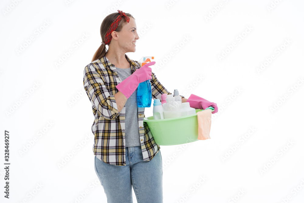 Portrait of happy female doing house duties wearing rubber gloves and holding cleaning equipment. Cheerful look. Hygiene, cleaning service concept. Isolated picture. White background. Portrait of happy female doing house duties wearing rubber gloves and holding cleaning equipment. Cheerful look. Hygiene, cleaning service concept. Isolated picture. White background.