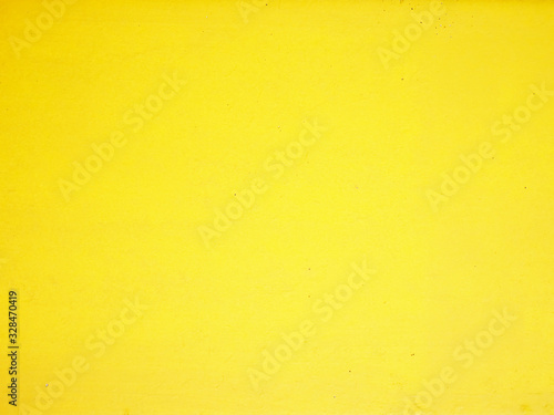 Yellow cement wall background.