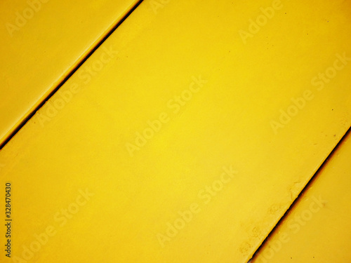Yellow cement wall background.
