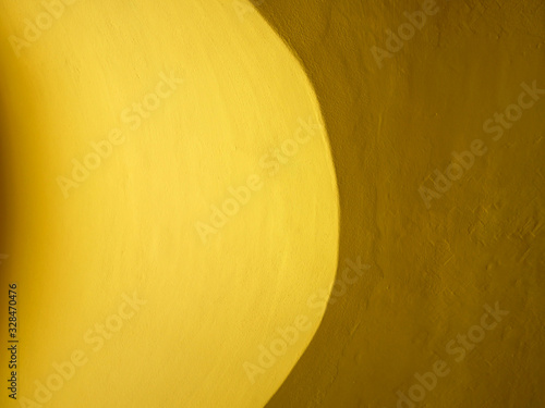 Yellow cement wall background.