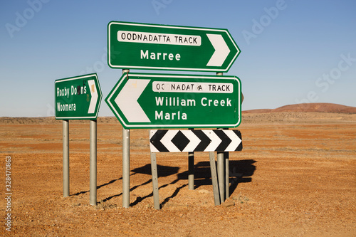 Roxby Downs Woomera, Maree and William Creek Marla Oodnadatta Track signposts roadside in the Australian Outback, South Australia photo
