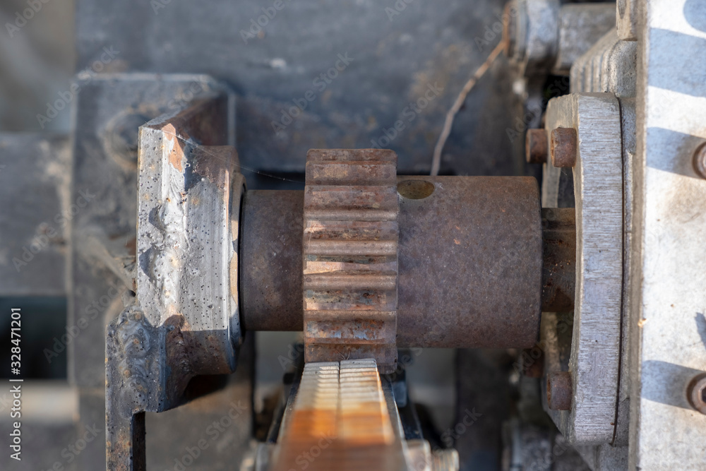 Details of rusty gear, rack and pinion.