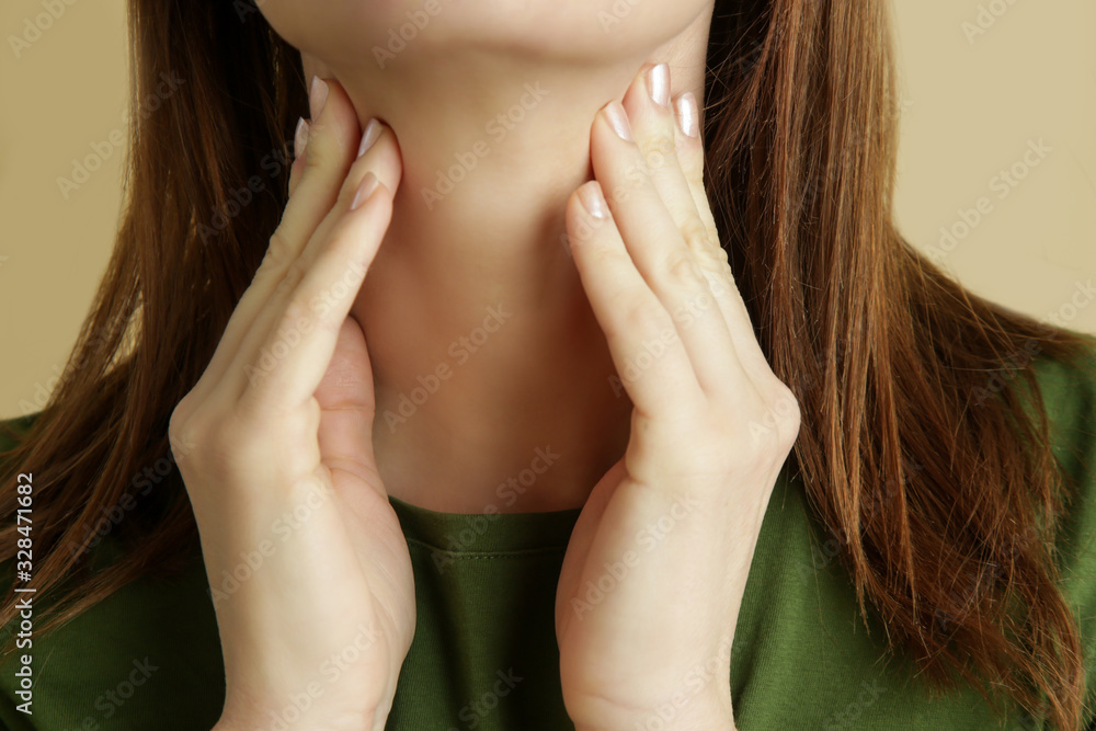Portrait of sick caucasian woman with sore throat, cold, flu or thyroid gland problem Portrait of sick caucasian woman with sore throat, cold, flu or thyroid gland problem