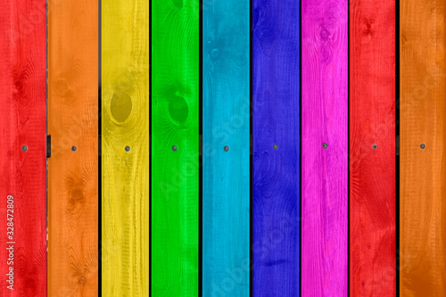 Rainbow colored wood background, copy space.