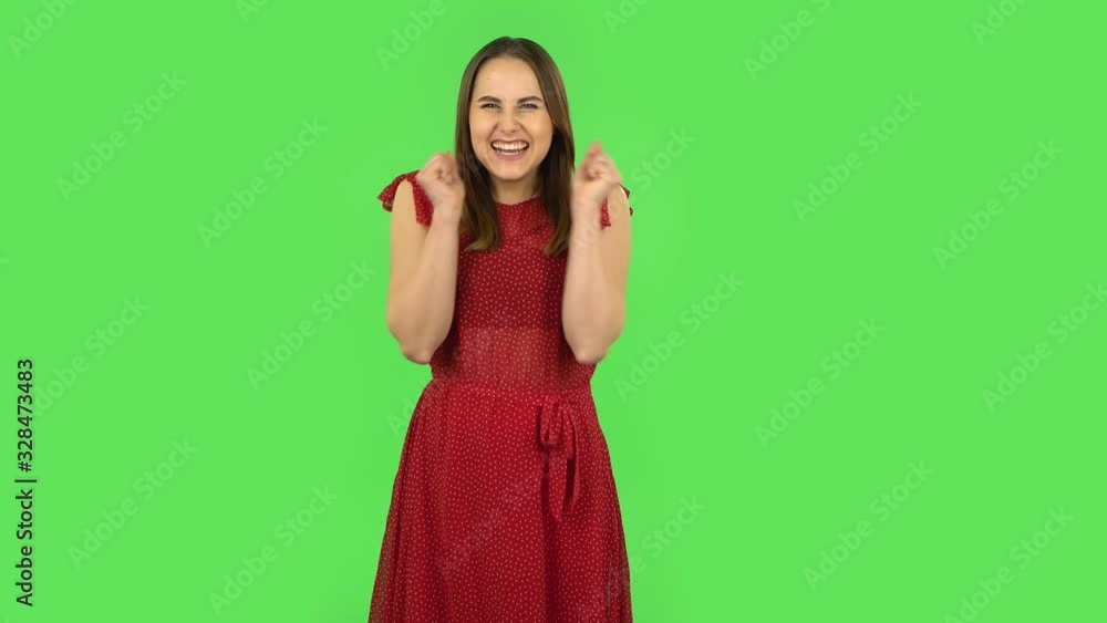 Tender girl in red dress with shocked surprised wow face expression. Green screen Tender girl in red dress with shocked surprised wow face expression. Green screen