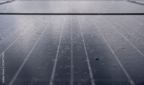 Solar panel with rain drops on it. Solar panel in rain. © Adil