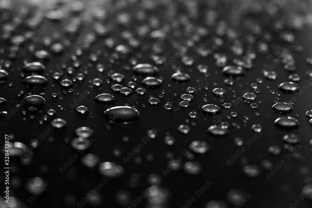 Water drops on a shiny surface, selective focus. Rain drops. Abstract background. Water drops on a shiny surface, selective focus. Rain drops. Abstract background.