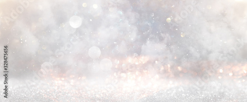 Fototapeta glitter vintage lights background. gold, silver and white. de-focused