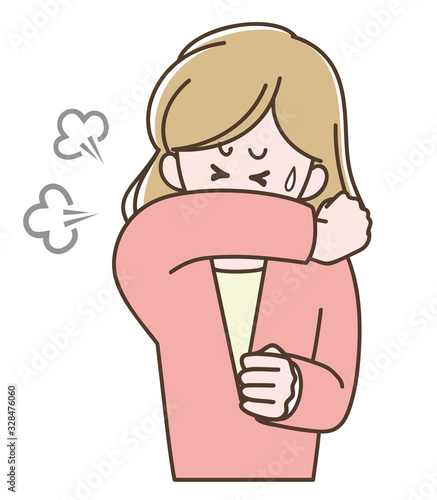 袖で口を覆って咳をする女性